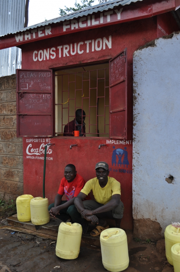 Men at a water storefront, Kibera slum