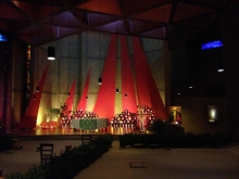 Candles, prayer benches and banners in the church at Taize